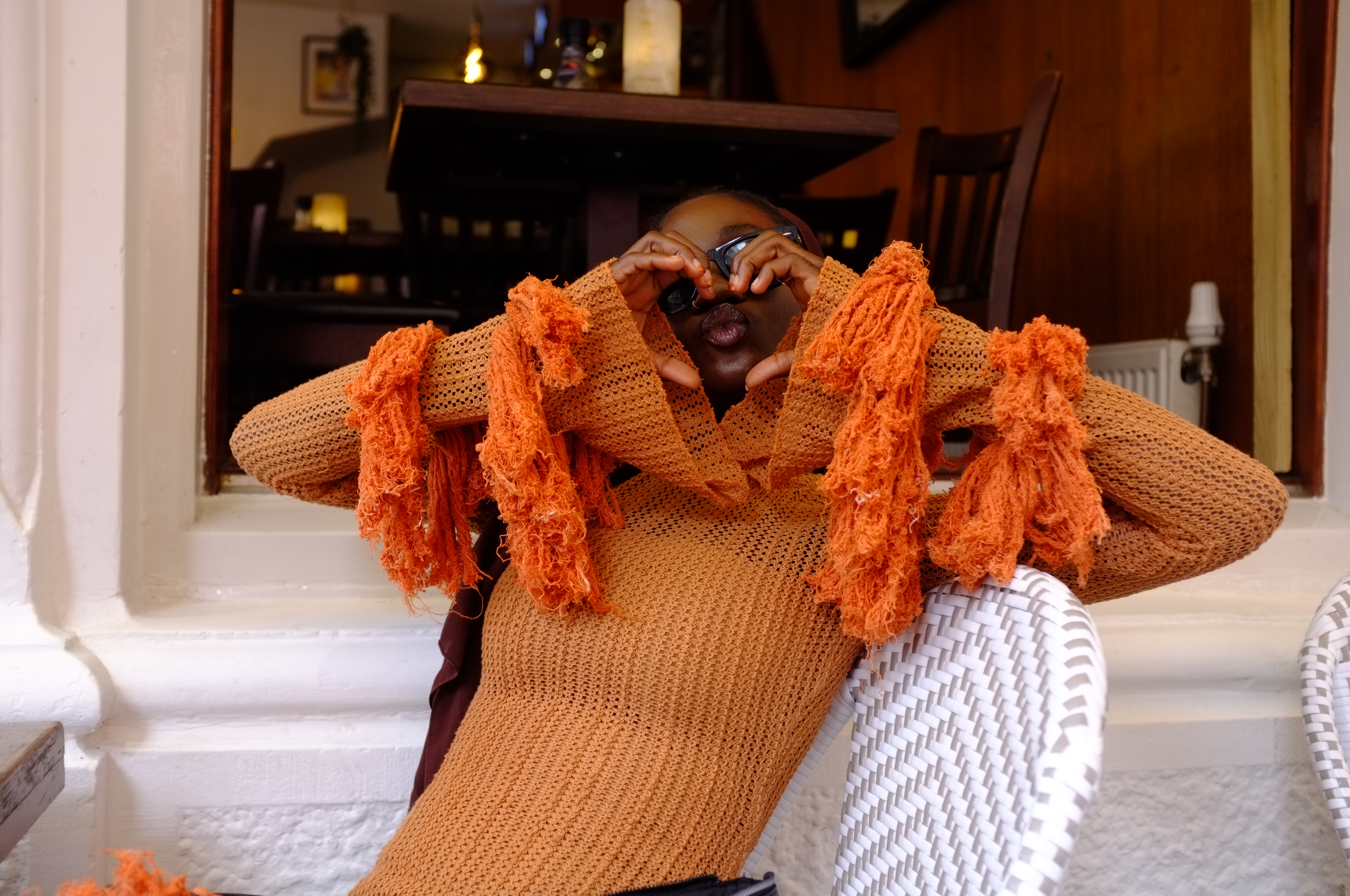 Hauwa Lawal making a heart with her hands
